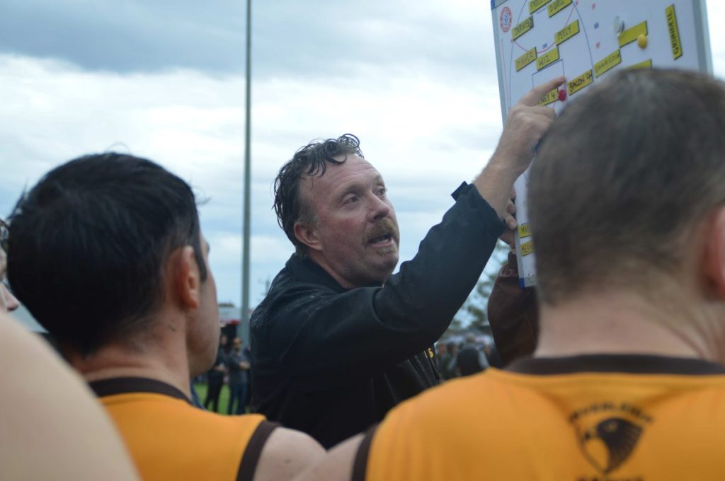 Hawks hang on for first win